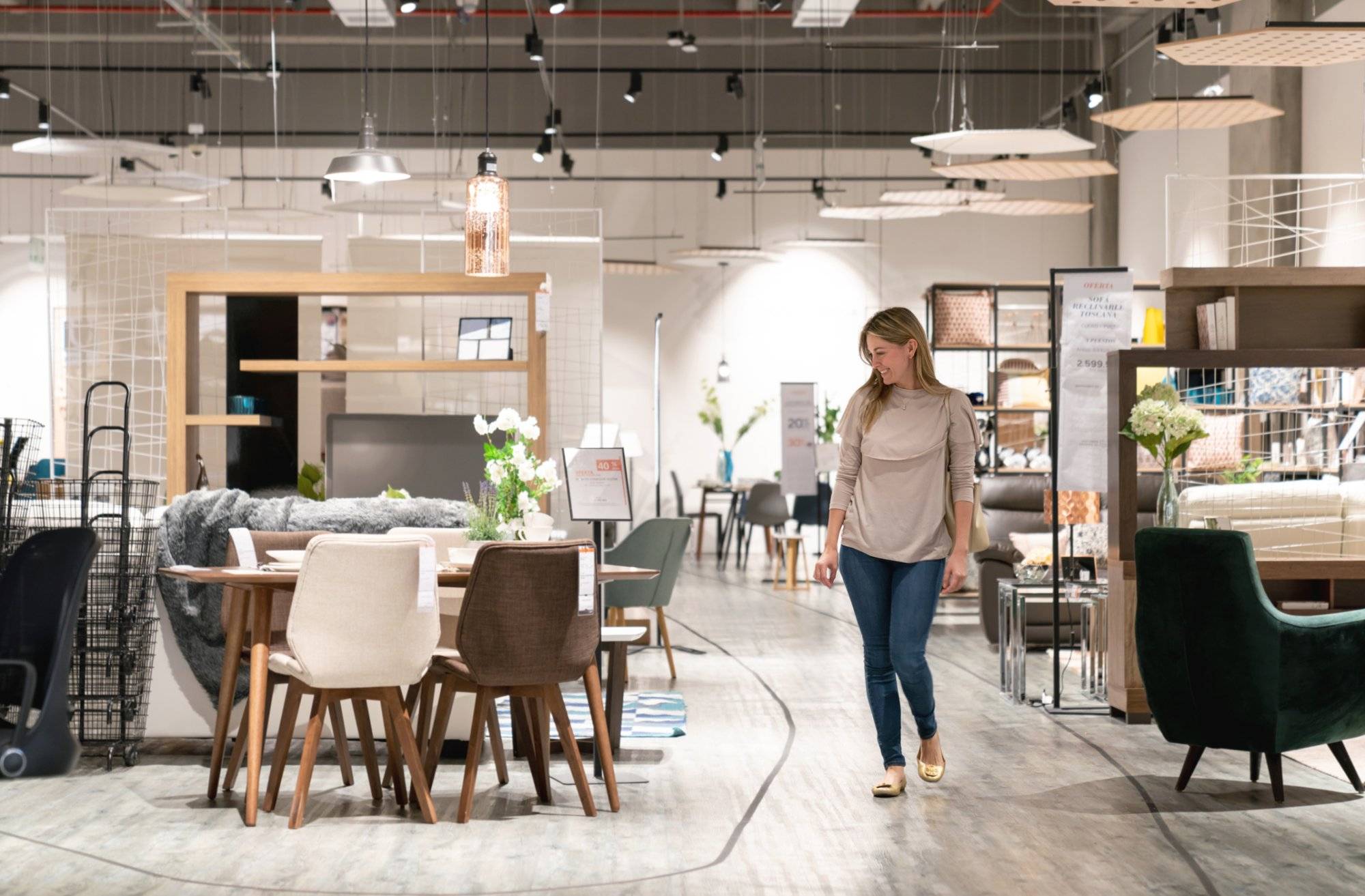 Happy woman shopping at a furniture store Happy woman shopping at a furniture store