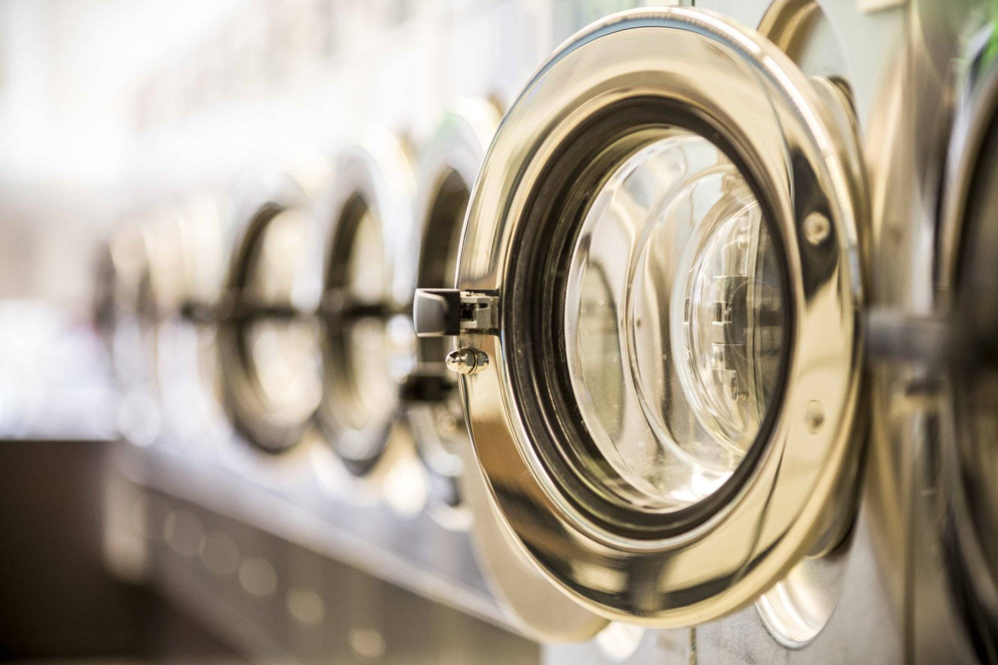 Washing machines - clothes washer’s door in a public launderette