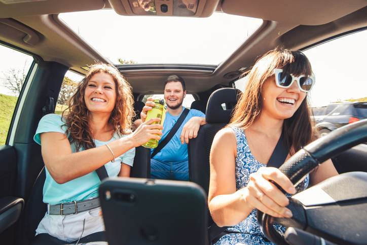 group of people travel by car.