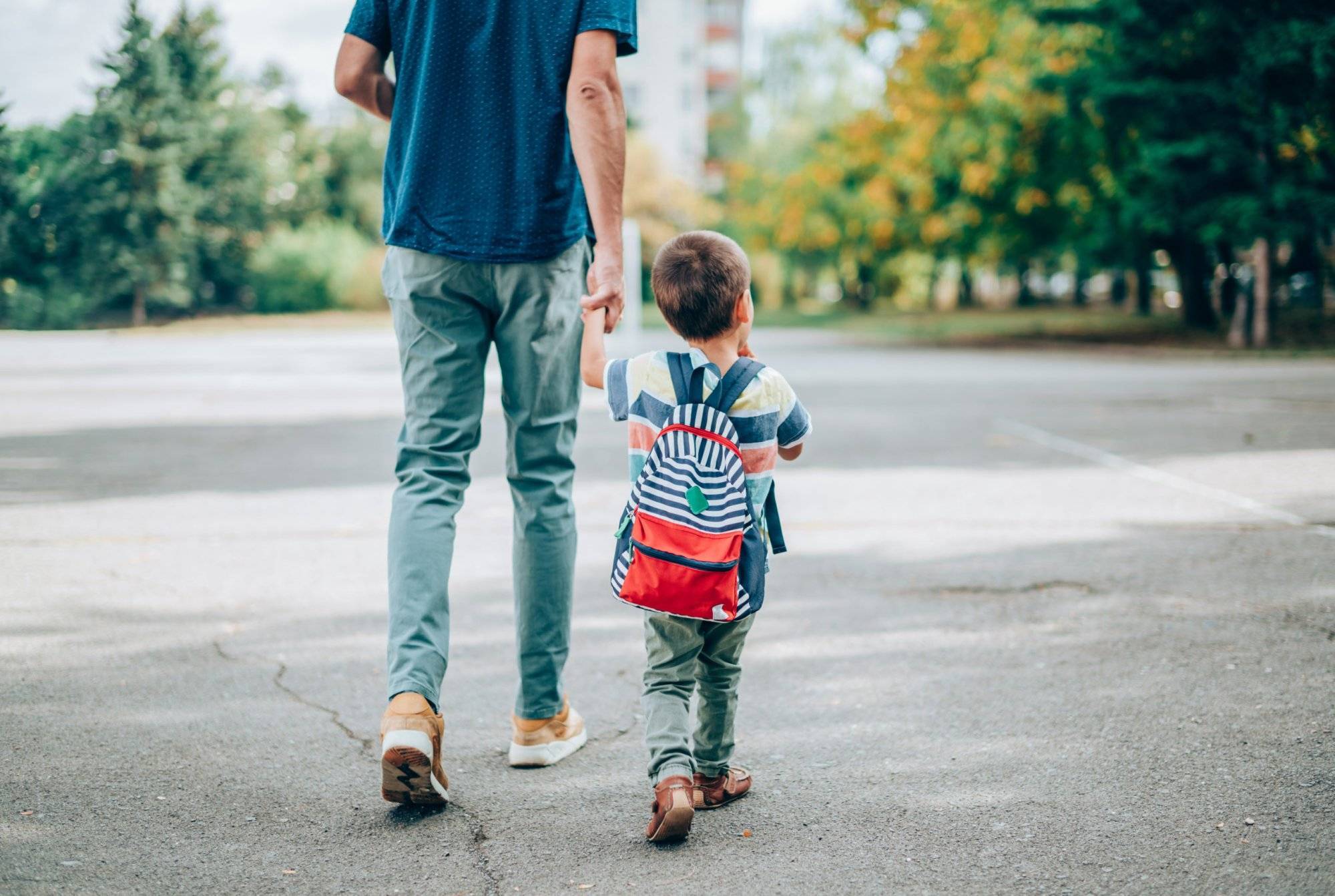 Father and son going to kindergarten. Father and son going to kindergarten.
