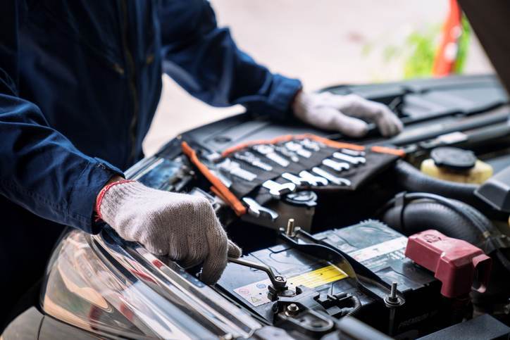 Auto mechanic working in the garage, Service and maintenance and car maintenance.