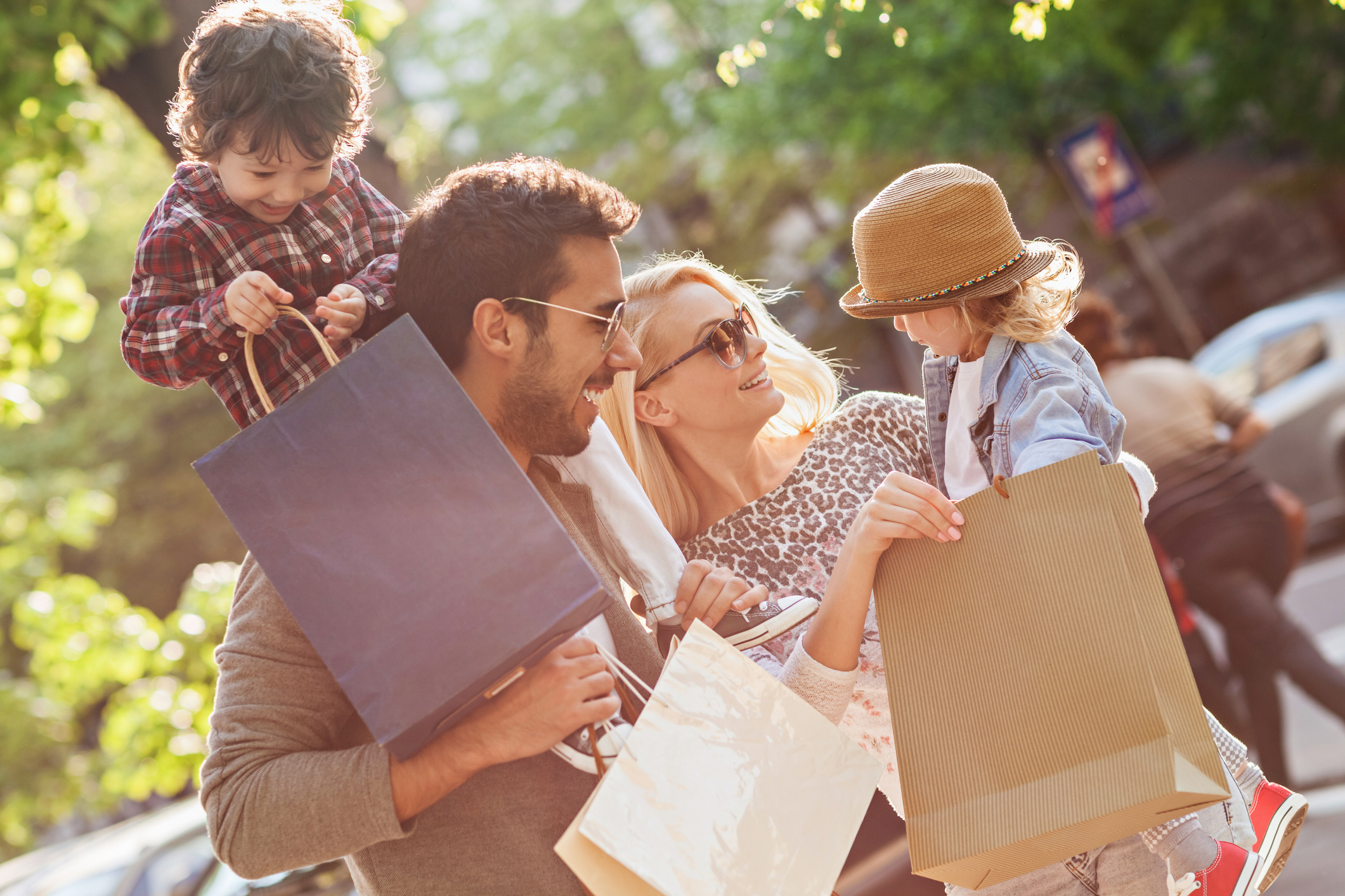 Photo of a young beautiful family enjoying shopping