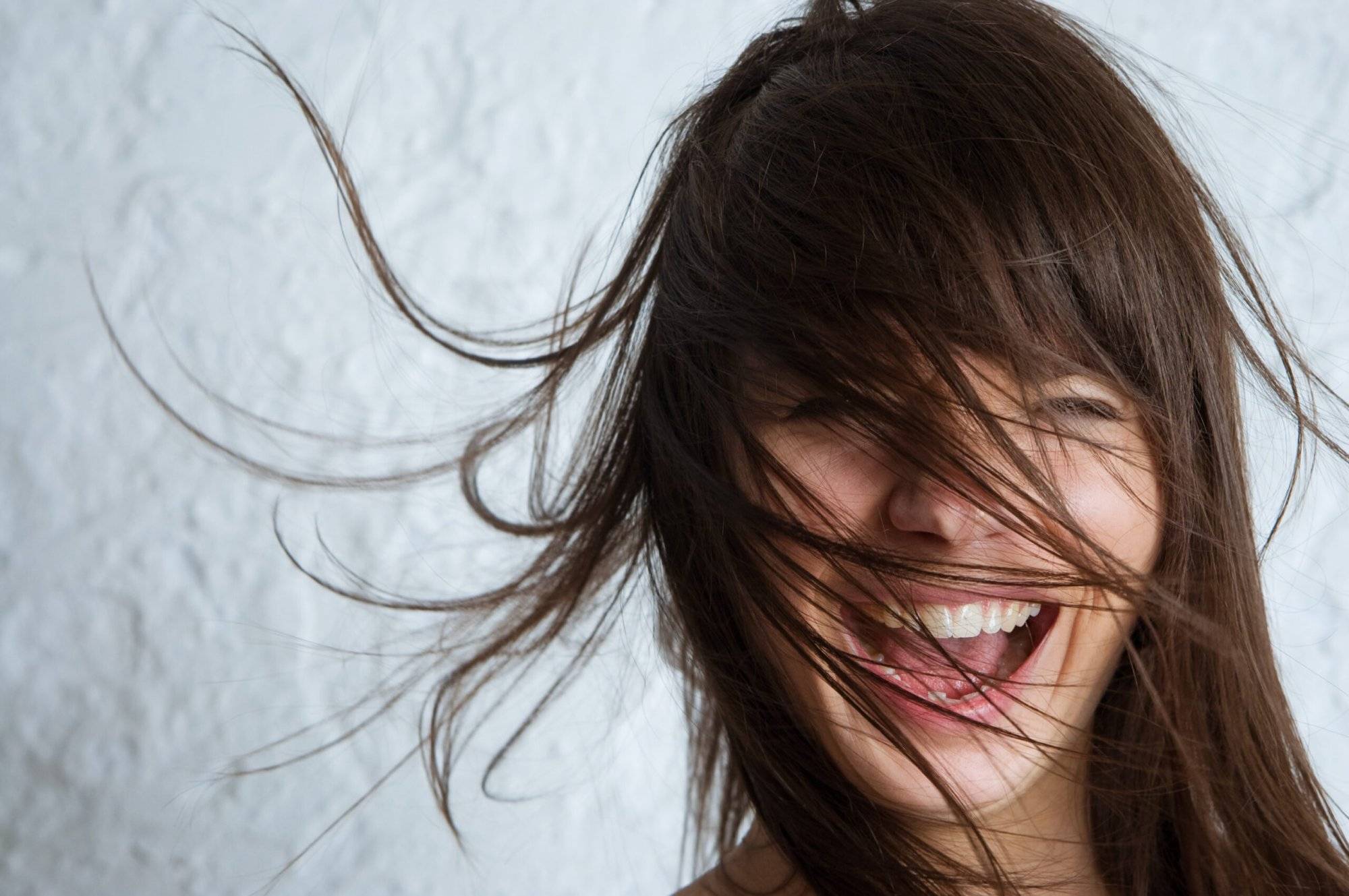 Smiling young woman Enhance Your Look at the Best Irving Hair Salon in Irving Towne Center